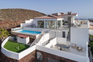 an aerial view of a house with a swimming pool at KARAT Villa Punta Rasca in Palm-mar