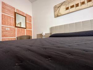 Voodi või voodid majutusasutuse LXR Rooms Carloforte toas