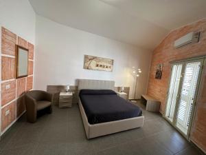 Voodi või voodid majutusasutuse LXR Rooms Carloforte toas