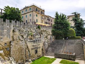 a set of stairs leading up to a castle at Hotel La Rocca in San Marino