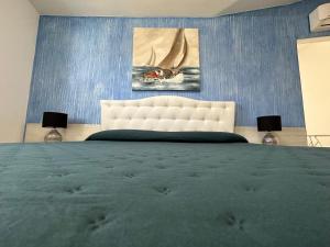 Voodi või voodid majutusasutuse LXR Rooms Carloforte toas