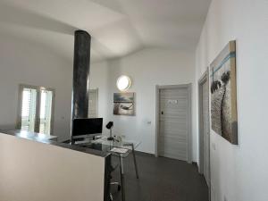 TV a/nebo společenská místnost v ubytování LXR Rooms Carloforte