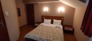 A bed or beds in a room at Restoran Filipovic