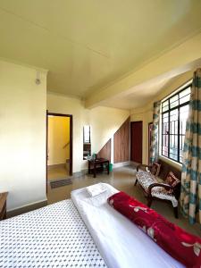 a bedroom with a large bed in a room at HEEMSTEDE in Shillong