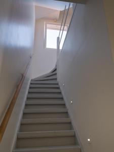 a staircase in a house with white walls at Julie's Boutique Guesthouse Ghent in Ghent