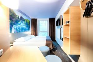 Postel nebo postele na pokoji v ubytování B&B Hotel Kassel-Süd