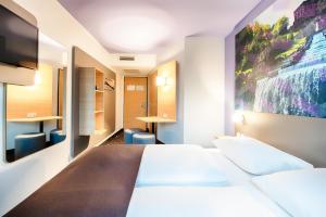 Postel nebo postele na pokoji v ubytování B&B Hotel Kassel-Süd