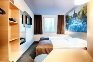 Postel nebo postele na pokoji v ubytování B&B Hotel Kassel-Süd