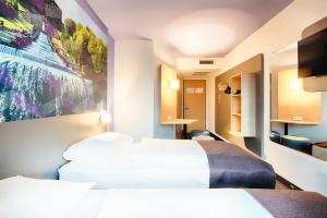 Postel nebo postele na pokoji v ubytování B&B Hotel Kassel-Süd