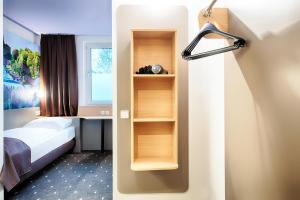 Postel nebo postele na pokoji v ubytování B&B Hotel Kassel-Süd