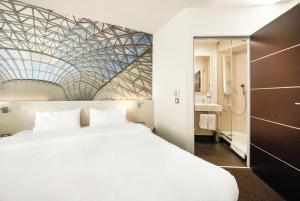 Postel nebo postele na pokoji v ubytování B&B HOTEL Katowice Centrum