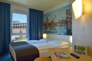 Postel nebo postele na pokoji v ubytování B&B Hotel Kiel-Wissenschaftspark