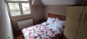 A bed or beds in a room at Restoran Filipovic