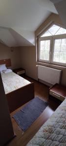 A bed or beds in a room at Restoran Filipovic