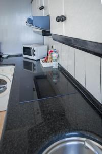 Kuchyňa alebo kuchynka v ubytovaní Apartamentos pilucha