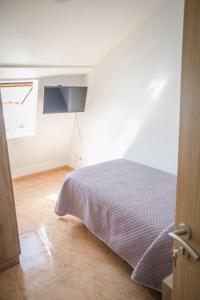 Posteľ alebo postele v izbe v ubytovaní Apartamentos pilucha
