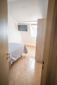 Posteľ alebo postele v izbe v ubytovaní Apartamentos pilucha