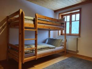 Posteľ alebo postele v izbe v ubytovaní Sunnaschi Appartements - Wohnungen oder gesamt als "Hütte"