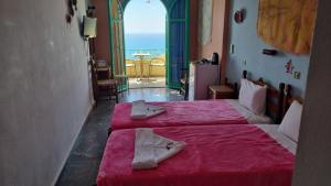 Posteľ alebo postele v izbe v ubytovaní Erofili Rooms