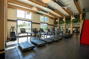 a gym with a bunch of exercise bikes and machines at Mountain View studio w pool gym nr tech HQs SFO-1206 in Sunnyvale
