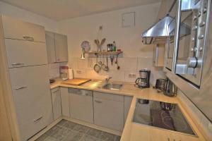a small kitchen with a sink and a counter at Prinz Heinrich App3 in Sassnitz