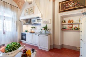 A kitchen or kitchenette at Villa Chianti, your Secret 4 Bedrooms Retreat with View over the Vineyards in Marcialla