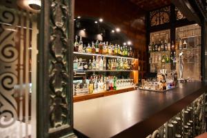 a bar with a lot of bottles of alcohol at Silken Ramblas in Barcelona