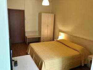 Postel nebo postele na pokoji v ubytování Hotel B&B Risorta