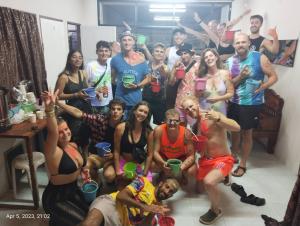 a group of people posing for a picture at a party at Seventeen Hostel in Haad Rin
