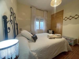 A bed or beds in a room at Casa Veva - Siles