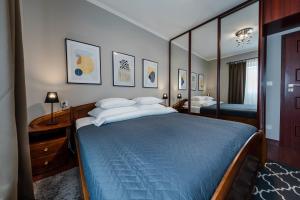 Posteľ alebo postele v izbe v ubytovaní Apartamenty Tespis - Dębowe Tarasy + 6 fotografií