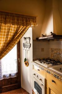 Ett kök eller pentry på Pizzalto - Dimora Rosy