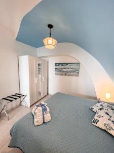 a bedroom with a large bed in a room at Calilla house by Procida Reserve in Procida
