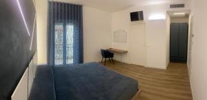 Giường trong phòng chung tại LD Ianuzziello Residence