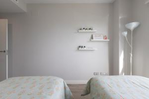 Кровать или кровати в номере Los Alamos Beach Flat