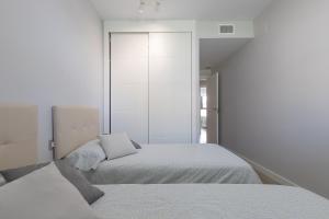 Кровать или кровати в номере Los Alamos Beach Flat