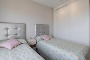 Кровать или кровати в номере Los Alamos Beach Flat