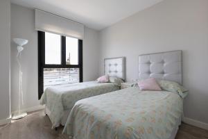 Кровать или кровати в номере Los Alamos Beach Flat