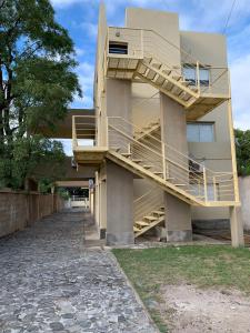 a building with stairs on the side of it at Apart Ocampo Catamarca II in San Fernando del Valle de Catamarca