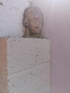 a statue of a head on a wall at No 12 B&B in Dungarvan