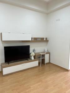 a living room with a large flat screen tv at Gragnano_roomandapartment in Gragnano