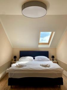 Ένα ή περισσότερα κρεβάτια σε δωμάτιο στο Home Sweet Apartment XL