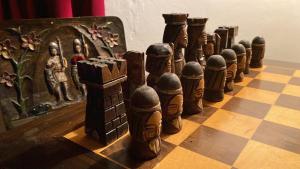 a chess board lined up on a chessboard at Burg Zimmer auf ca. 70 m² in Heimbach +1 photo