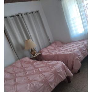 Voodi või voodid majutusasutuse Belretiro Cottage toas