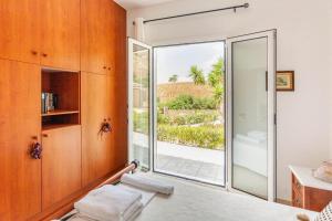Postel nebo postele na pokoji v ubytování Eleanna Eco House