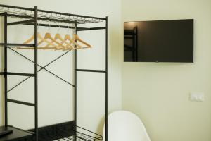 a walk in closet with a glass door and a mirror at In centro apartment in Palermo