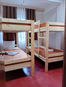 a pair of bunk beds in a room at Baguio Camella Big Brother House in Baguio