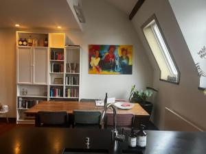 a kitchen and dining room with a table and a window at W Y C K - E N D boutique b&b in Maastricht