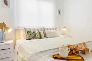 Posteľ alebo postele v izbe v ubytovaní Apartamento Pink VistaBella Sunrise