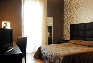 Ein Bett oder Betten in einem Zimmer der Unterkunft Atmosfere Milano Marittima